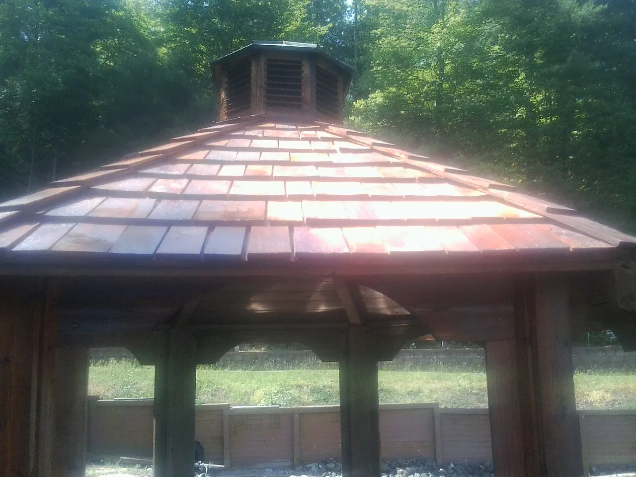 New cedar shake roof and cupola on a lakeside gazebo in Rancho Santa Margarita